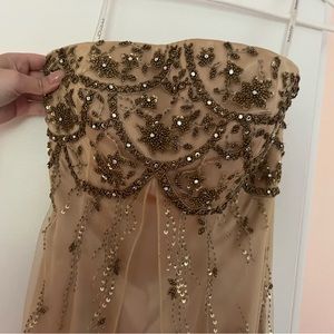 Gold sleeveless prom dress with beading